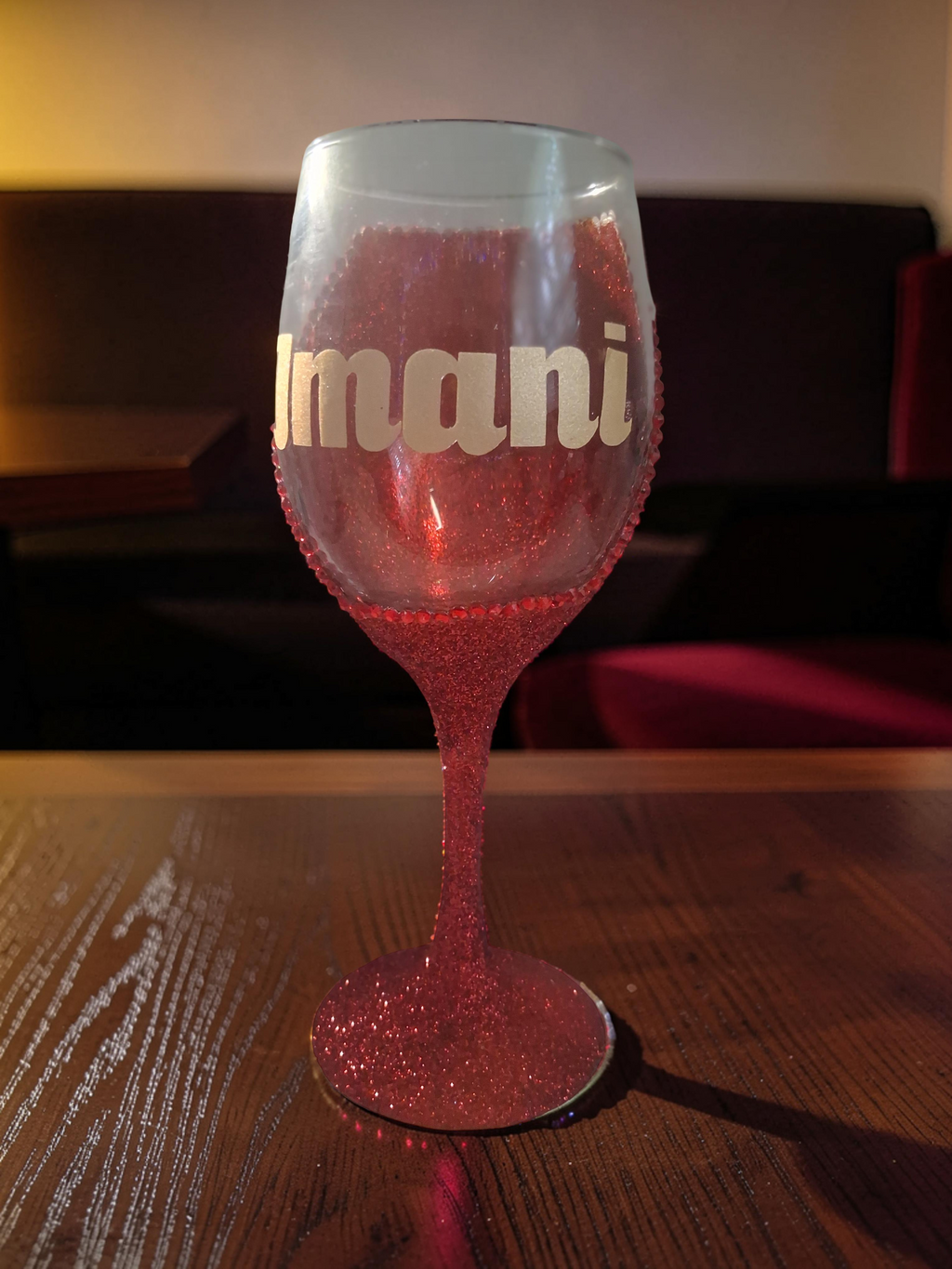 Ruby Glam personalized red glitter wine glass with Imani name in gold lettering