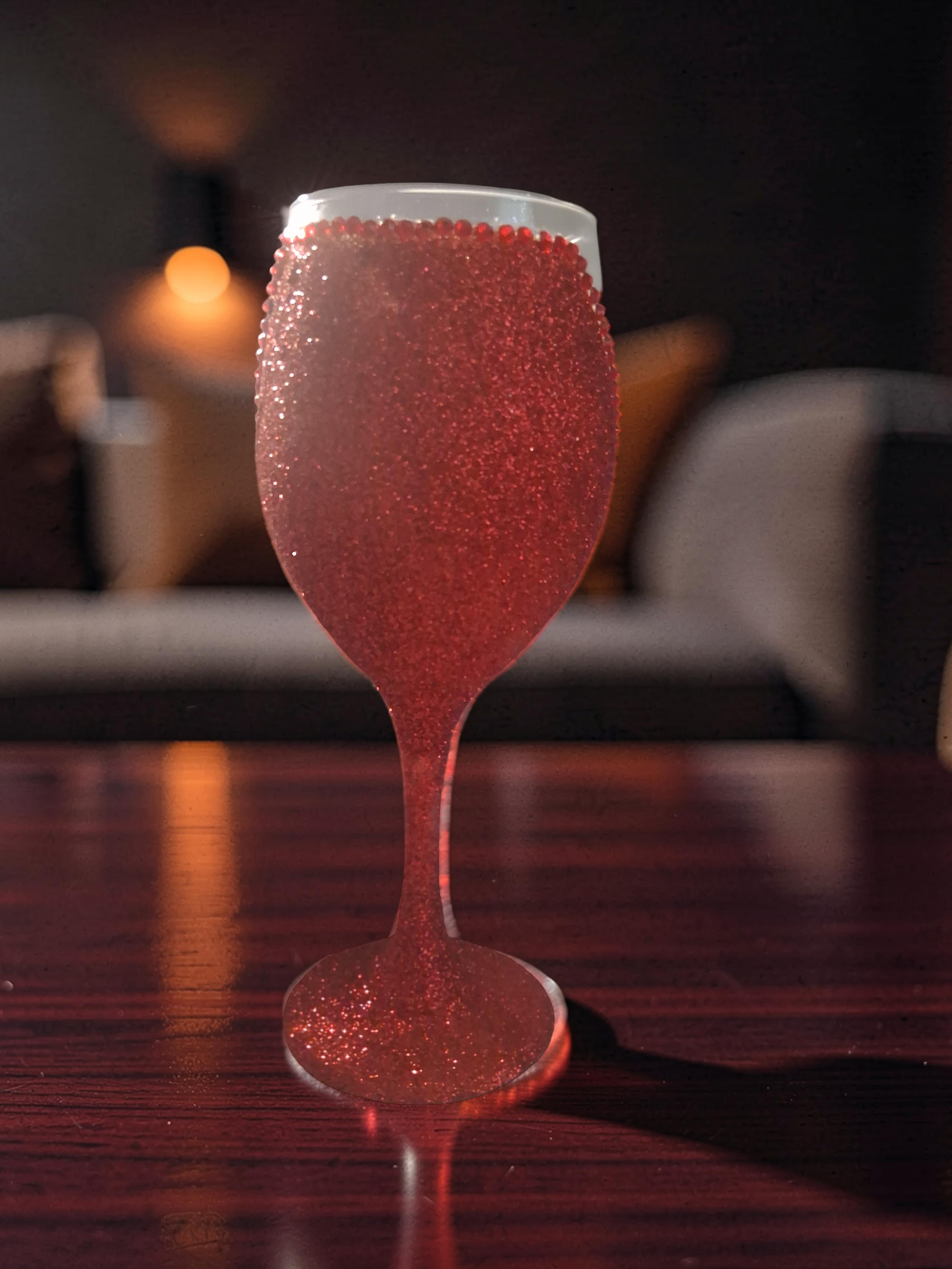 Ruby Glam red glitter wine glass close up showing glitter detail and rhinestone rim